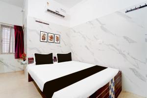 Postel nebo postele na pokoji v ubytování Super Hotel O Coimbatore Hopes College