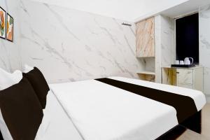 Postel nebo postele na pokoji v ubytování Super Hotel O Coimbatore Hopes College