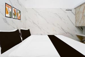Postel nebo postele na pokoji v ubytování Super Hotel O Coimbatore Hopes College