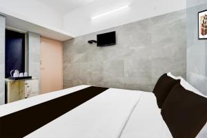 Postel nebo postele na pokoji v ubytování Super Hotel O Coimbatore Hopes College