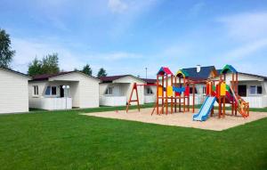 a playground with a slide in a yard at Beautiful Home In Przewloka in Przewłoka