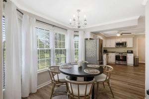a kitchen and dining room with a table and chairs at Private Neighborhood Getaway - Big Backyard & Game Room in Cedar Grove