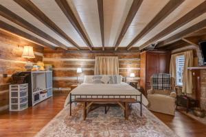 a bedroom with a bed and a table at Hickory Haven Cozy Lakefront Escape & Dock in Cadiz +40 photos