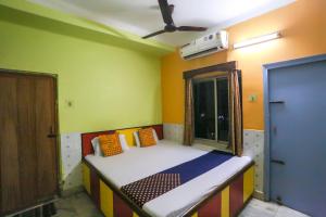 Voodi või voodid majutusasutuse Hotel O Bideshini Hotel toas