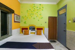 Voodi või voodid majutusasutuse Hotel O Bideshini Hotel toas