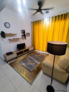 a living room with a couch and a yellow curtain at Mellgyp Homestay Bangi Kajang in Kajang
