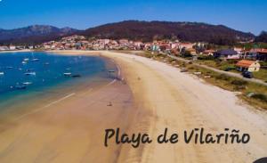 a view of a beach with boats in the water at Da Cañota1, Playas Vilariño, Hío y Aldán in Aldán +19 photos