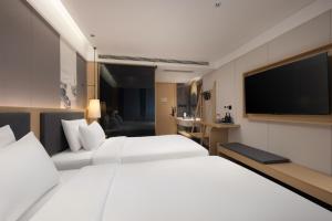 Tianhai Botang Hotel, Guling Street, Lushan Scenic Area客房内的一张或多张床位