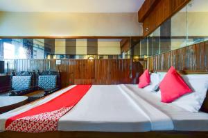 Postel nebo postele na pokoji v ubytování Hotel O Unique + 21 fotografií