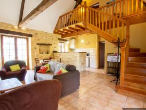 a living room with a staircase and a living room at Charmante maison Perigord avec parking et cheminée - Saint-Avit-Rivière - FR-1-616-180 in Saint-Avit-Rivière +8 photos