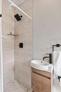 a bathroom with a sink and a shower at Timber Lodge #7 in Colorado Springs +17 photos