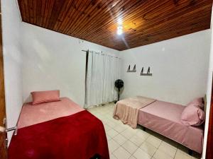 Rúm í herbergi á Casa em Condominio no Centro para 6 pessoas