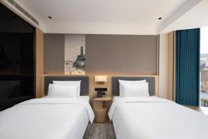 Tianhai Botang Hotel, Guling Street, Lushan Scenic Area客房内的一张或多张床位