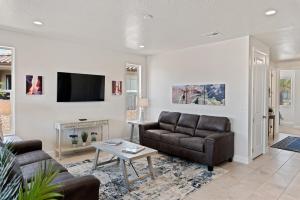 a living room with a couch and a fireplace at Always the Weekend - Pool, Lazy River, Waterslide in Washington