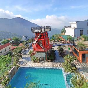 a resort with a water slide next to a pool at Happy Villa Tam Đảo in Tam Ðảo