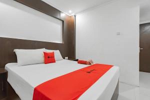Ένα ή περισσότερα κρεβάτια σε δωμάτιο στο Hotel Grand Ompo