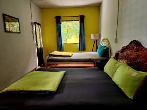Giường trong phòng chung tại Maison du Pays de Bến Tre