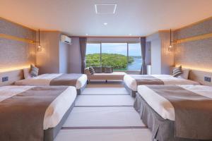 En eller flere senger på et rom på Ooedo Onsen Monogatari Premium Iseshima