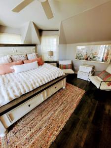 a bedroom with a large bed and a rug at Enchanting Chateau By The Beach - STR15-0330 in Dana Point