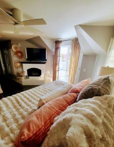 a bedroom with a large bed and a tv at Enchanting Chateau By The Beach - STR15-0330 in Dana Point +8 photos