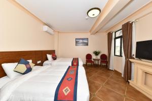 TV a/nebo společenská místnost v ubytování Sapa Symphony Hotel