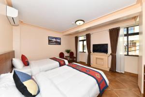 TV a/nebo společenská místnost v ubytování Sapa Symphony Hotel