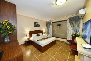 TV a/nebo společenská místnost v ubytování Sapa Symphony Hotel