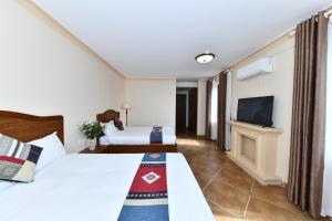 TV a/nebo společenská místnost v ubytování Sapa Symphony Hotel