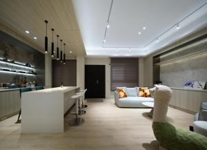 a living room with a white couch and a table at 芙若蕥居 in Qingshui