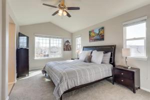a bedroom with a bed and a ceiling fan at Family home 2 Master Suites with King beds fast Wifi workspace in Foxfield