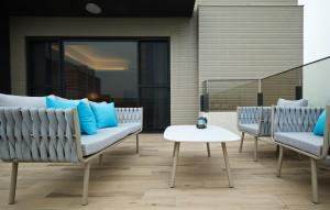 a patio with two chairs and a table at 芙若蕥居 in Qingshui