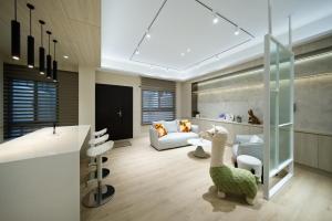 a living room with a table and a living room with a couch at 芙若蕥居 in Qingshui
