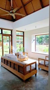 a bedroom with two beds in a room with windows at Julita Boutique Villas in Burgos