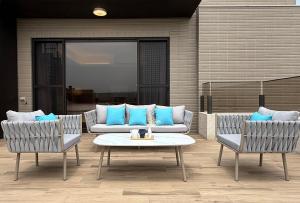 a patio with two chairs and a couch and a table at 芙若蕥居 in Qingshui