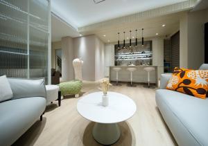 a living room with a couch and a table at 芙若蕥居 in Qingshui