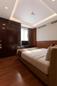 Postel nebo postele na pokoji v ubytování Mercury Boutique Hotel + 37 fotografií
