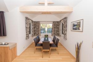 a dining room with a table and chairs at Apartment Angerer Bad Aussee in Bad Aussee +27 photos