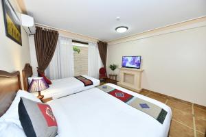 TV a/nebo společenská místnost v ubytování Sapa Symphony Hotel