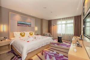 a hotel room with a large bed and a bathroom at Lavande Hotel Wuhan Jianghan Road Subway Station in Wuhan