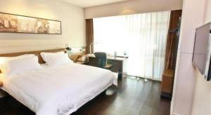 Postel nebo postele na pokoji v ubytování Jinjiang Inn Select Xi'an Hongmiaopo East Daxing Road