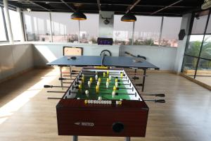 a room with two ping pong tables in it at FF21-Hbr in Bengaluru