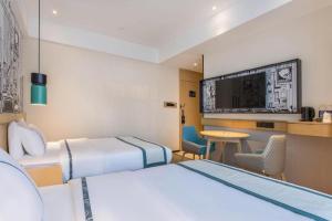 TV a/nebo společenská místnost v ubytování City Comfort Inn Jinzhou Bohai University Wanda Plaza