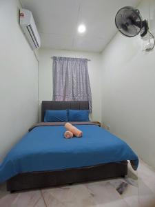 Ένα ή περισσότερα κρεβάτια σε δωμάτιο στο Garden Homes Simple Seremban 2