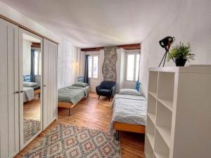 Ένα ή περισσότερα κρεβάτια σε δωμάτιο στο The Blue Nest - Città Vecchia Locarno