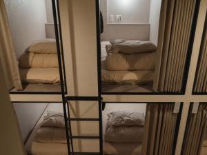 Posezení v ubytování HOTEL minimumms女性専用カプセルホテルWomen only hotel