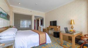 Postel nebo postele na pokoji v ubytování Vienna Hotel Guangdong Zhuhai Mingzhu Station Guozheng