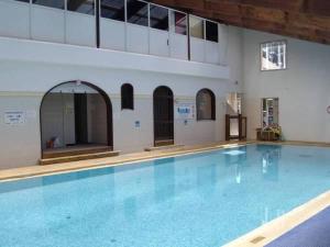 a large swimming pool in a building at Mobil Home in Saint-Jean-de-Monts +17 photos