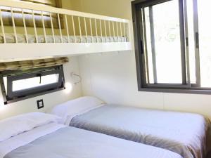 Katil atau katil-katil dalam bilik di Albaluce Village Viverone