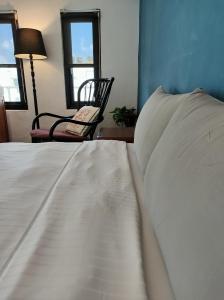 Łóżko lub łóżka w pokoju w obiekcie Kenting Cozy B&B