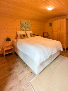 Vuode tai vuoteita majoituspaikassa Luxueux Chalet au centre de Champéry vue panoramique